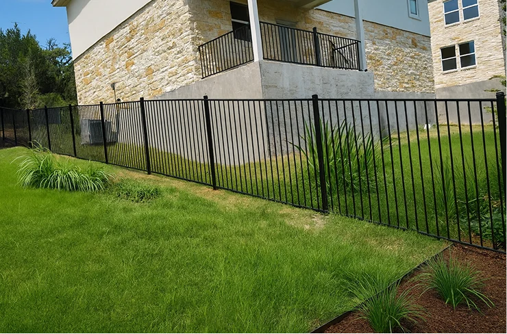 Iron gate along slanted side yard in Austin, Texas.